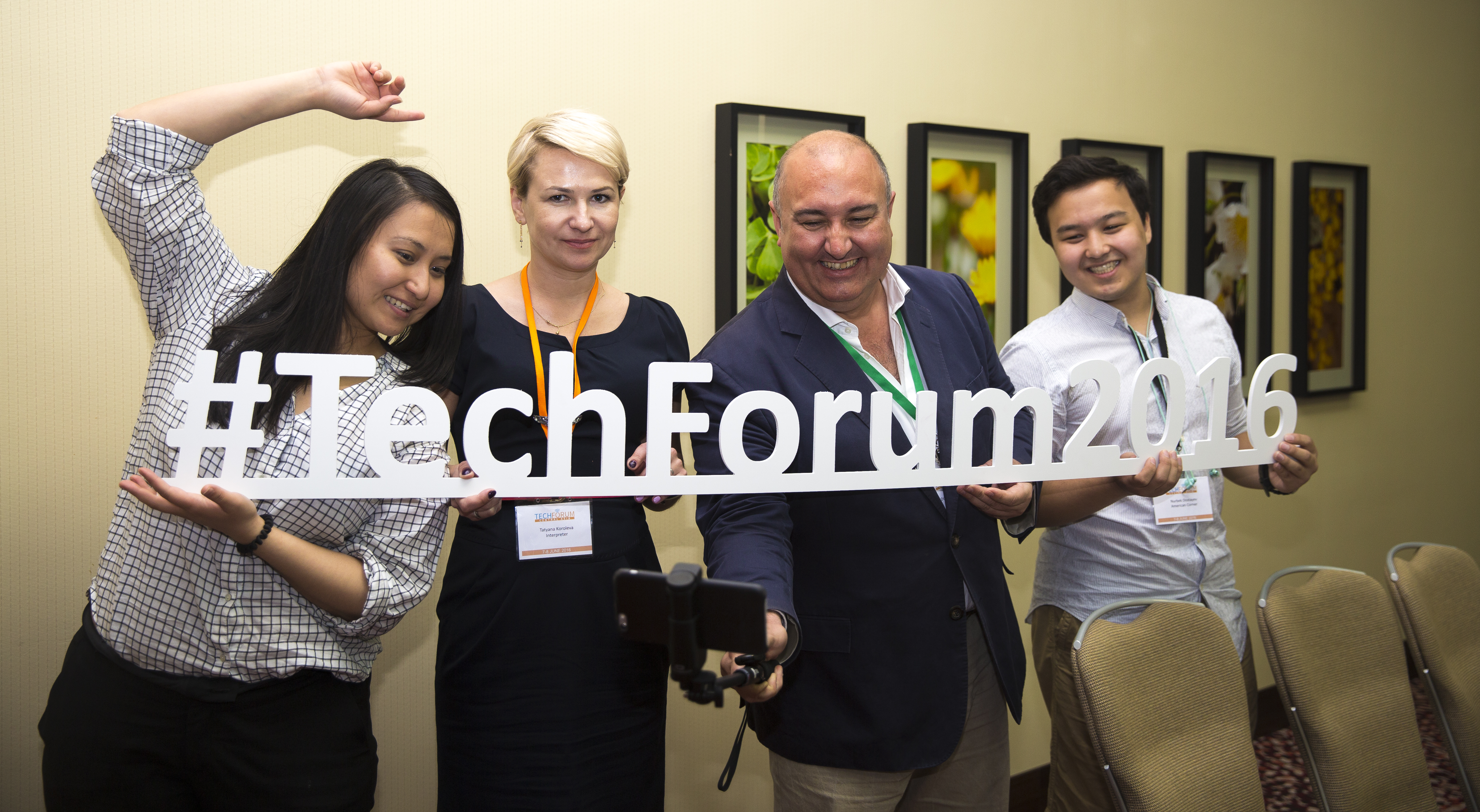 TechForum Central Asia participants and trainers posing with hashtags during a break